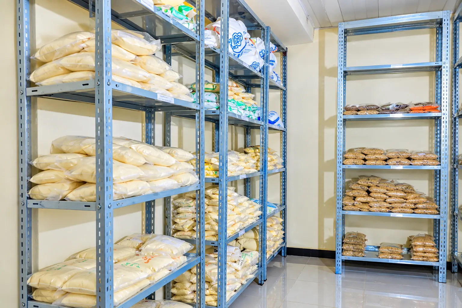 Packaged grain and flour product samples arranged on storage shelves
