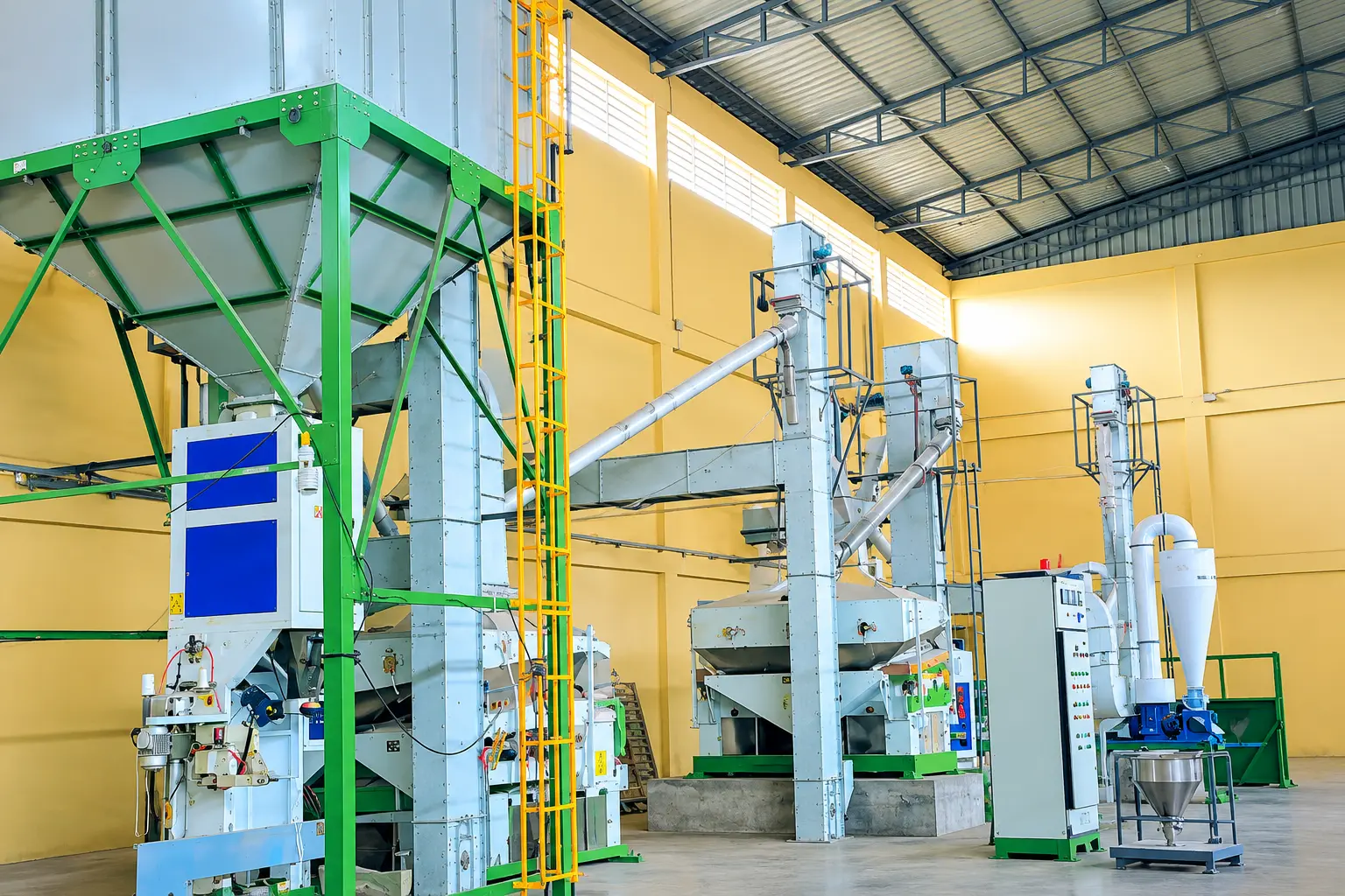 Milling line with bucket elevators, sieving machines and process control panel