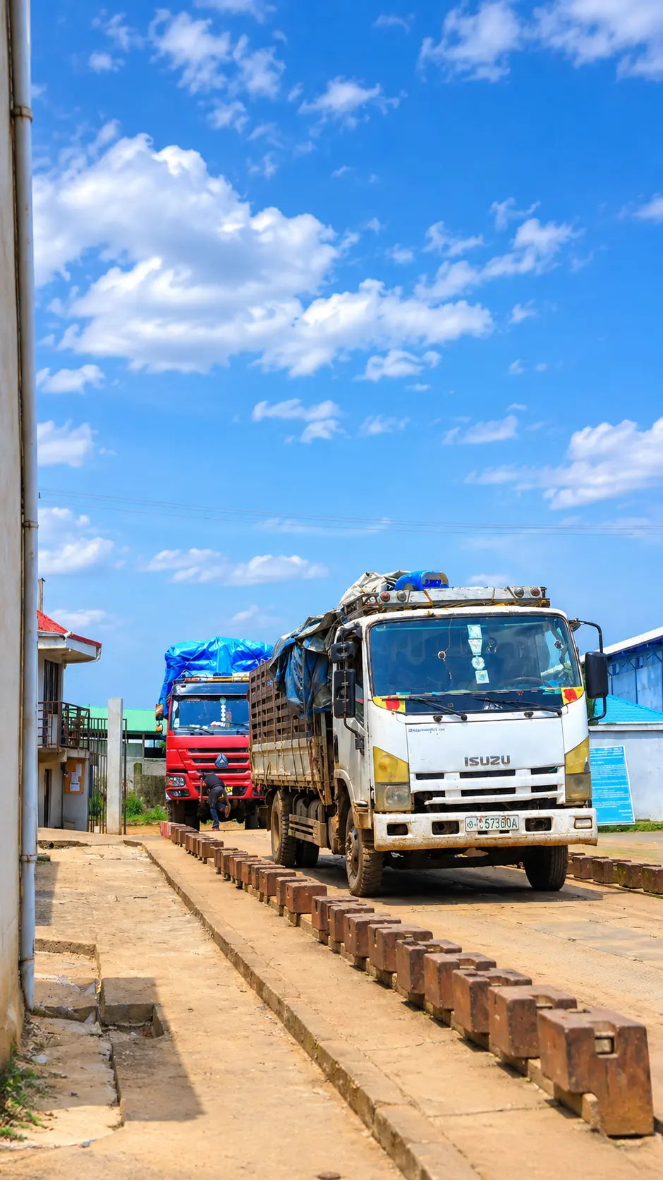 Two loaded trucks on the weighbridge at the Quarit facility